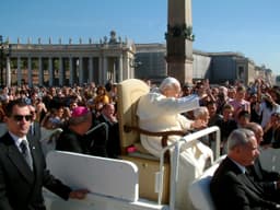 An elderly Pope John Paul II seated at a papal audience on 29 September 2004, in his final months of Parkinson's disease