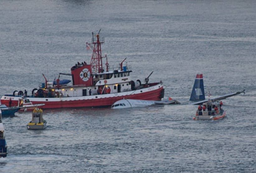 U.S. Coast Guard boats surrounding the partially submerged US Airways Airbus A320 floating in the Hudson River during the rescue of passengers on 15 January 2009.