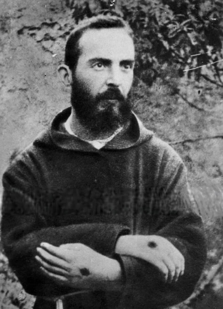 Sepia photograph of a young Padre Pio showing the stigmata on his hands, taken 19 August 1919