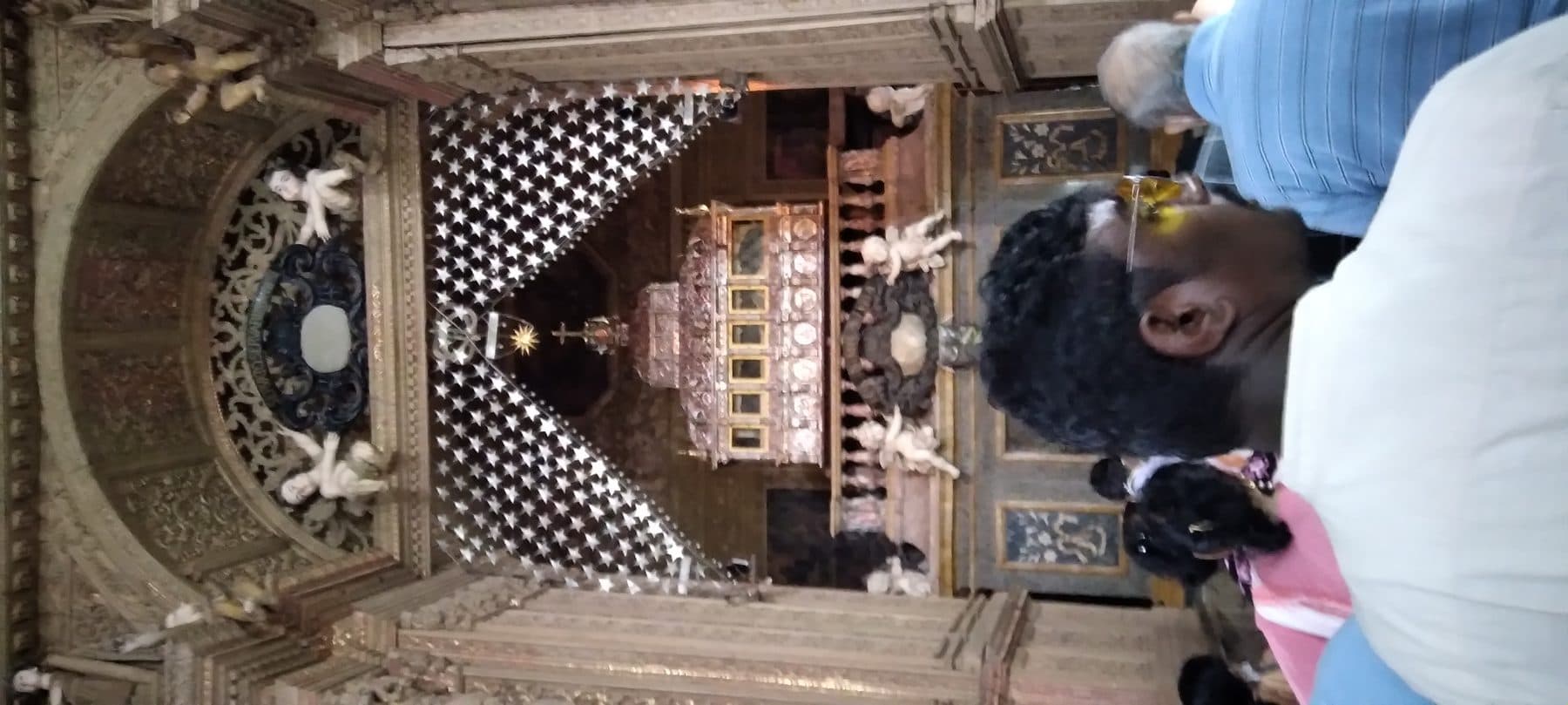 The ornate marble-and-bronze mausoleum topped by the silver casket holding the relics of St. Francis Xavier, inside the Basilica of Bom Jesus in Old Goa, India.